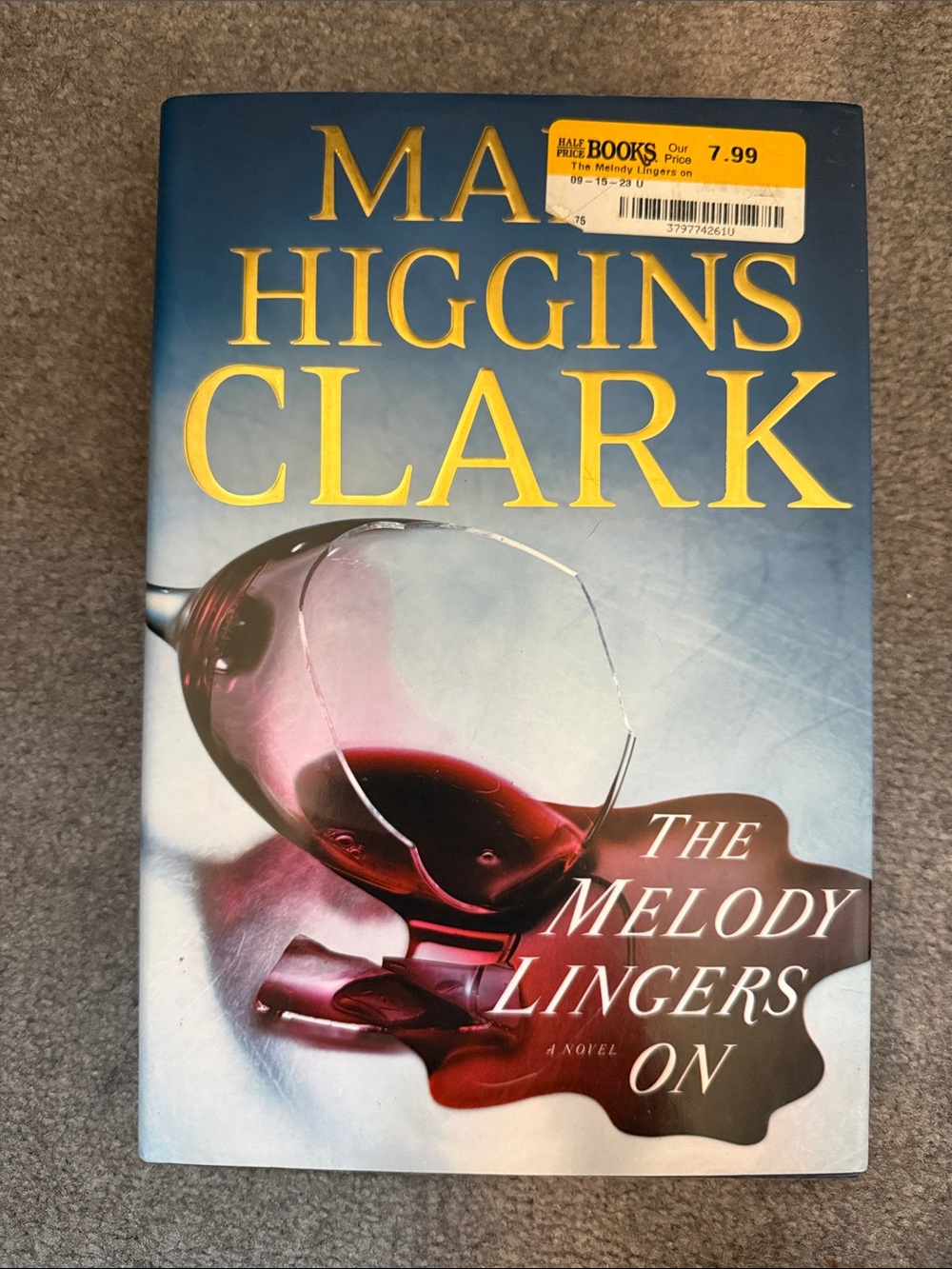 Mary Higgins Clark "The Melody Lingers On" - Blue Cover with Gold Title
